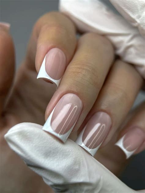 Elegant French Tip Nails for April 2025 with Glossy Nude Base and Soft Shine в 2025 г