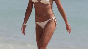 Kelly Bensimon Flashes Her Nude Boob Posing In A White Bikini Photos