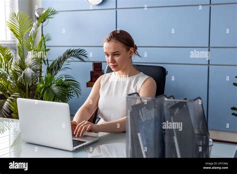 Portrait Of Blonde Woman At The Office With Laptop Computer Stock Photo Alamy
