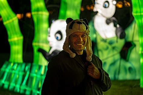 Premium Photo Portrait Of Smiling Man Wearing Panda Cap At Amusement Park