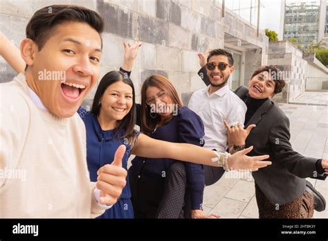 Closeup Of Co Workers Leaving The Office Chatting Together Stock Photo