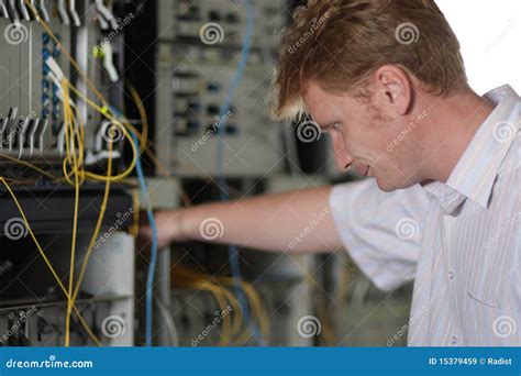 Telecom Engineer Looks On Multiplexer Stock Image Image Of People