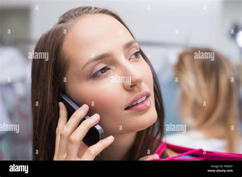 Pretty Brunette Talking On The Phone Stock Photo Alamy