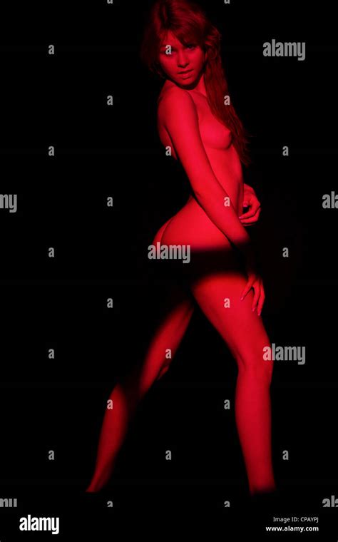 Nude Woman In Red Shadow Stock Photo Alamy