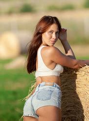 The Alluring Brunette Wriggles Out Of Her Booty Hugging Jean Shorts And