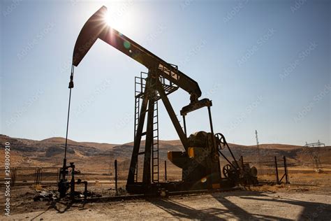 Oil Drilling Derricks At Desert Oilfield Crude Oil Production From The