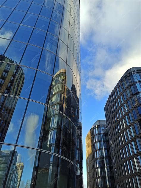 Premium Photo | Tall glass buildings are skyscrapers. business city.