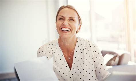 Her Hard Work Has Paid Off A Mature Businesswoman Working From Her Home Office Stock Image