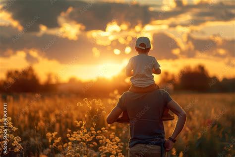 father  son hugging sunset trip warm  harmonious life  father