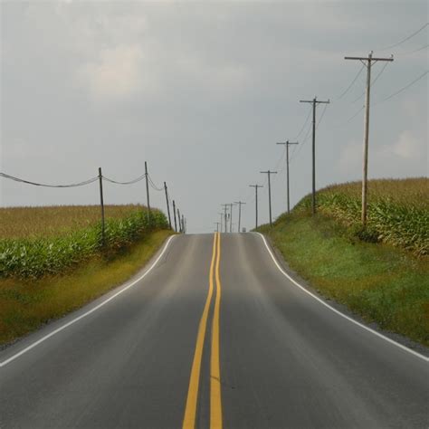 premium photo road passing  field