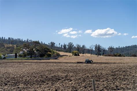 Premium Photo Tractor Plowing A Field In A Dry Hot Summer Farming