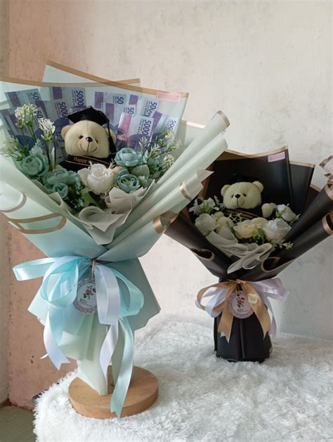 Two Teddy Bears Are Holding Bouquets Of Flowers