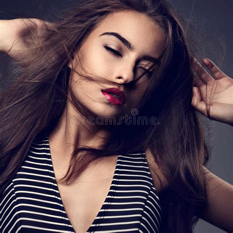 Beautiful Indian Woman With Nude Makeup And Long Brown Curly Hair Style Pink Lipstick Touching