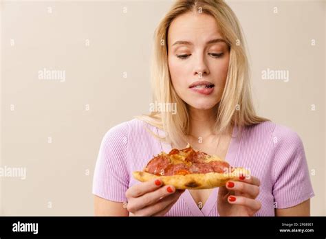 Confused Beautiful Blonde Girl Posing With Pizza Isolated Over White Background Stock Photo Alamy