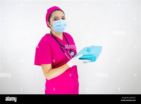 Beautiful Female Medical Assistant Wearing Face Mask Pink Uniform And