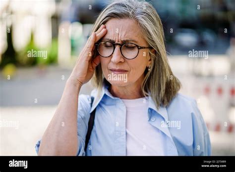 Feeling Hard Headache Migraine Mature Grey Haired Woman 50s 60s Standing Outdoors Holding Her