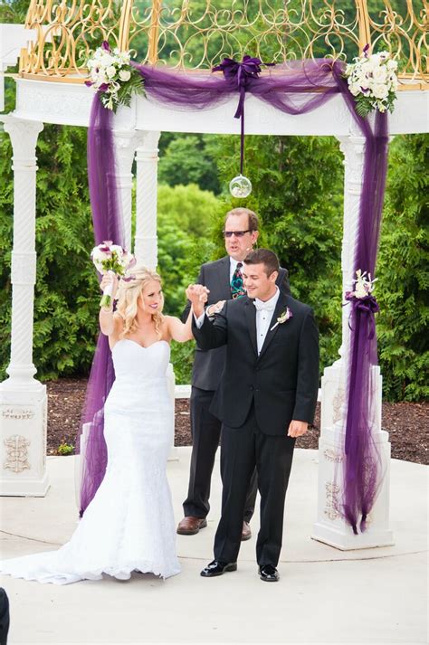 White Wedding Arch with Purple Draped Tulle