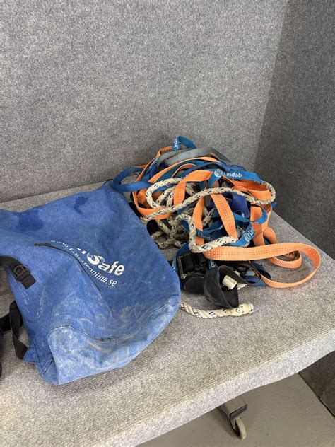 Collection of fall protection equipment - harnesses, ropes, helmets and