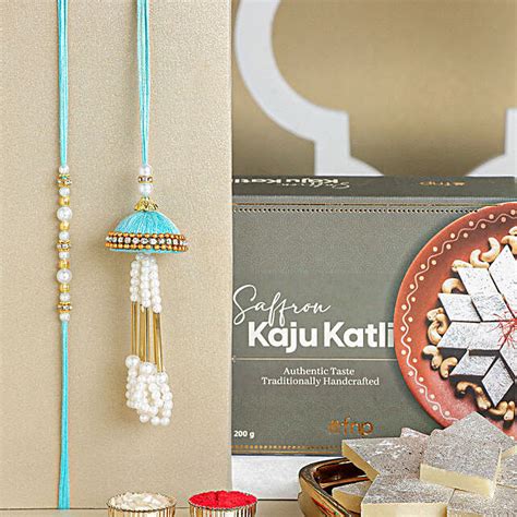 Tranquil Teal Jhumar Bhaiya Bhabhi Pearl Rakhi Set Kaju Katli Delight