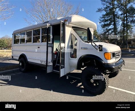 Used bus upgraded with oversized wheels and customized for off-roading ...