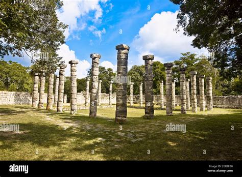 Old Ruins Of Columns In A Grassy Field The Market Chichen Itza