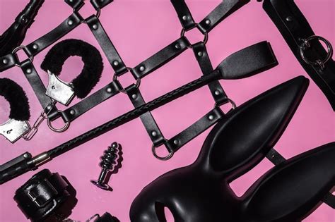 Premium Photo Handcuffs Whip Flogger For BDSM Sex With Submission And Domination A Set Of