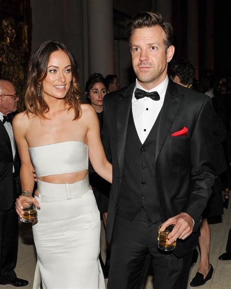 Olivia Wilde and Jason Sudeikis held each other on their way into the