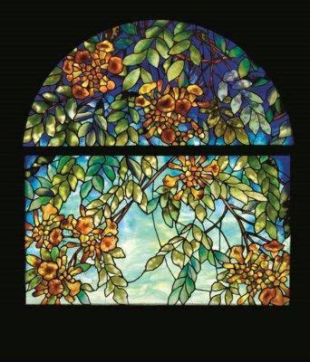 a stained glass window with flowers on it