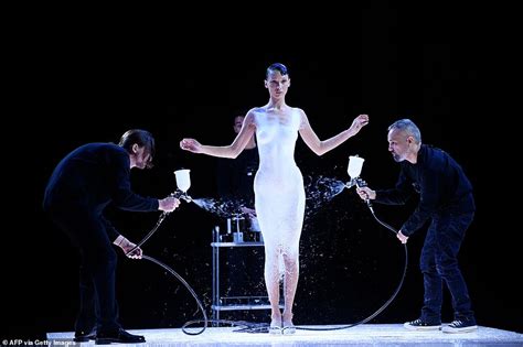 Bella Hadid Takes To The Runway Nude Before Her Dress Is SPRAYED ON In An Incredible Moment At