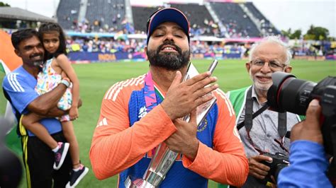 Coming Home Rohit Sharma Poses With T20 World Cup Trophy As Team India