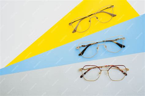 Premium Photo Stylish Eyeglasses Modern Eyeglass Frames On A Colored