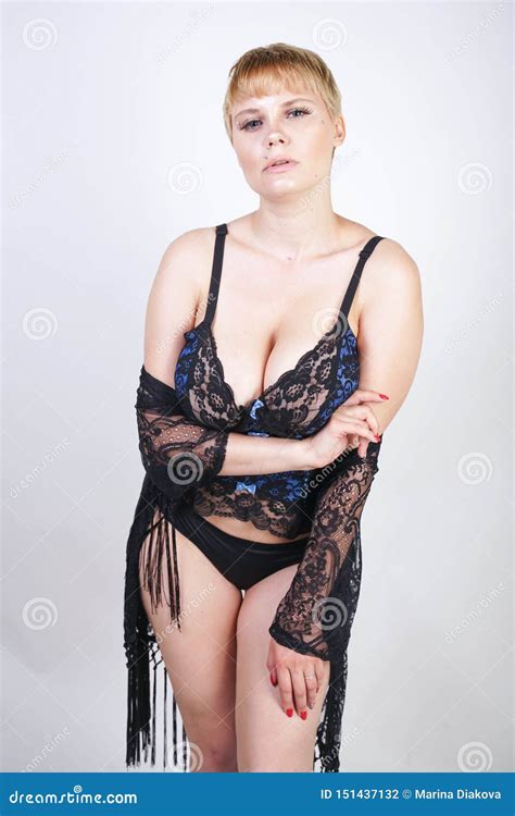 Plus Size Woman With Short Hair In Blue And Black Lace Corset Lingerie