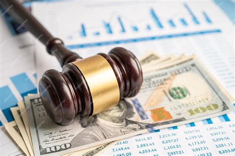 premium photo gavel  judge lawyer   dollar banknotes