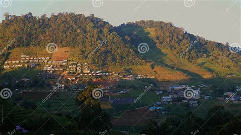 Thailand Village On Mountain Slope With Row Of Camping Tents At Sunset