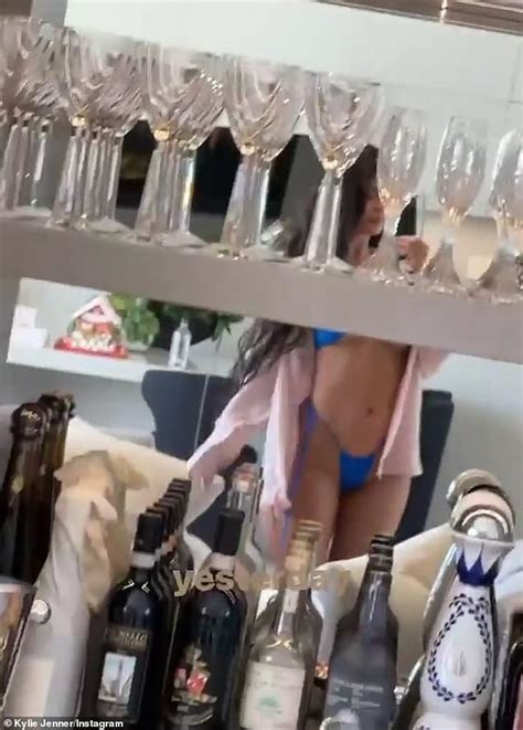 Kylie Jenner Teases Her Curves In The Mirror As She Films Herself While Wearing A Blue Bikini