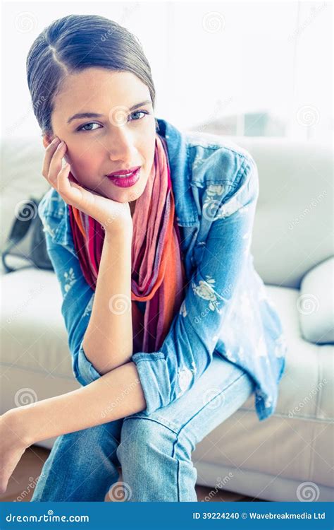 Pretty Brunette Sitting On Sofa Smiling At Camera Stock Photo Image Of Adult Cute