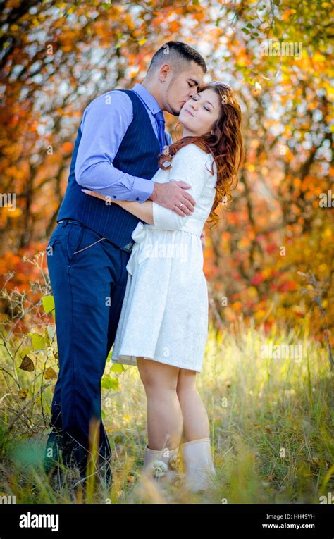 Young couple embracing on nature background. Wedding. Love Stock Photo ...