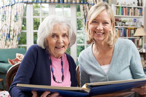 Senior Woman Looks Album Mature Female Neighbor Stock Photos Free