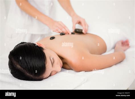 Pretty Woman Receiving A Hot Stone Massage Stock Photo Alamy