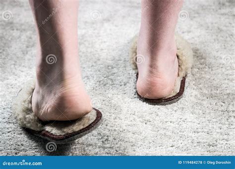 Slippers on Feet on the Carpet in the Room Stock Photo - Image of bath ...