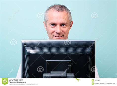 Mature Man Working At A Computer Stock Photo Image Of Looking Friendly