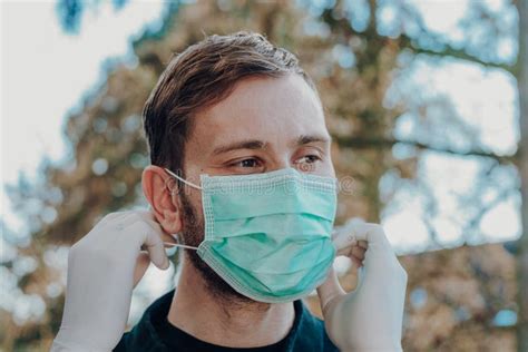 Man Wearing Face Mask And Gloves To Prevention Of Contamination