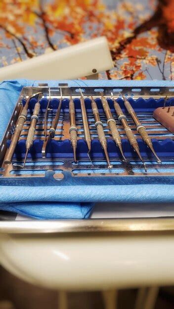 Premium Photo A Row Of Dental Deep Cleaning Equipment On A Tray