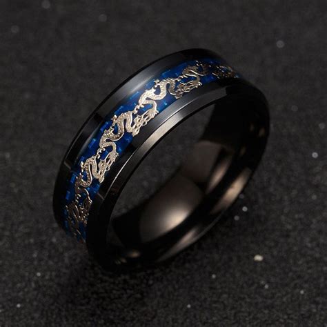 a black and blue ring with gold dragon designs