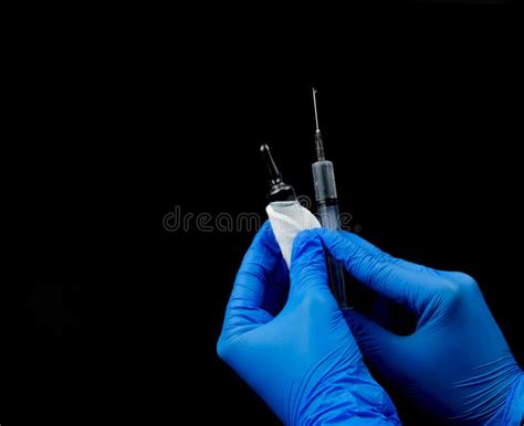 Blue Gloved Hands Hold An Ampoule And A Syringe Stock Photo Image Of