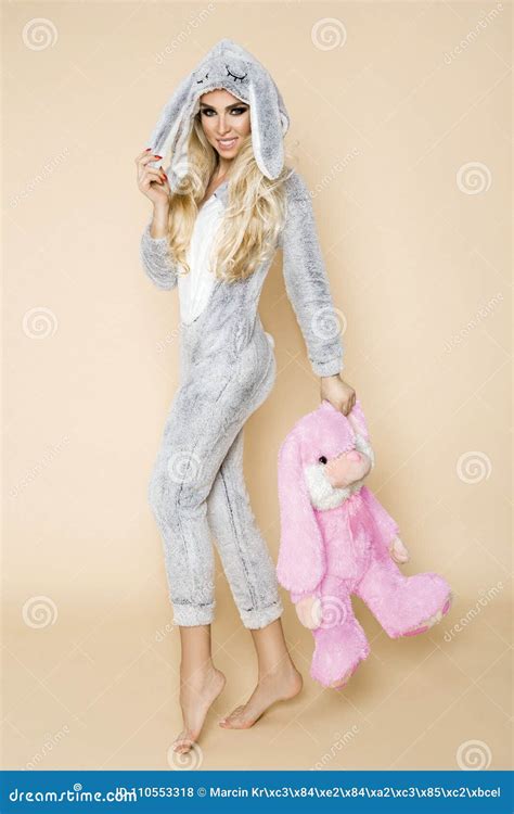 Beautiful Blonde Woman Wearing A Pajama A Bunny Costume Smiling