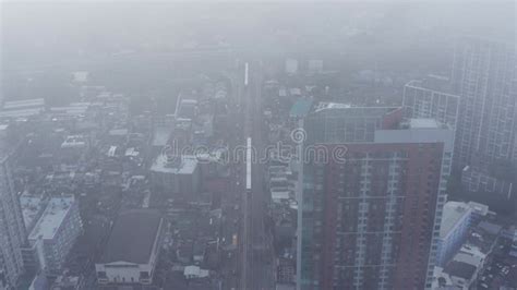 Clouds Drone Birds Eye View Of BTS Skytrain On Sukhumvit Street In