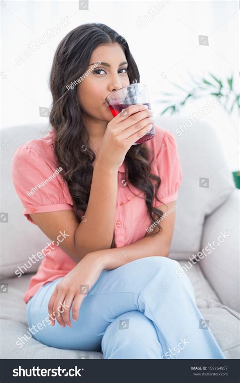 Content Cute Brunette Sitting On Couch Stock Photo Shutterstock