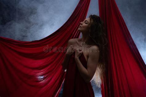 Gorgeous Nude Woman With Red Color Silk Concept Of Sexuality And Sensitivity Stock Photo