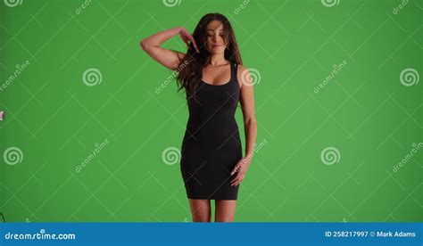 Portrait Of Latina Female In Tight Black Dress Dancing Sensually On Green Screen Stock Video